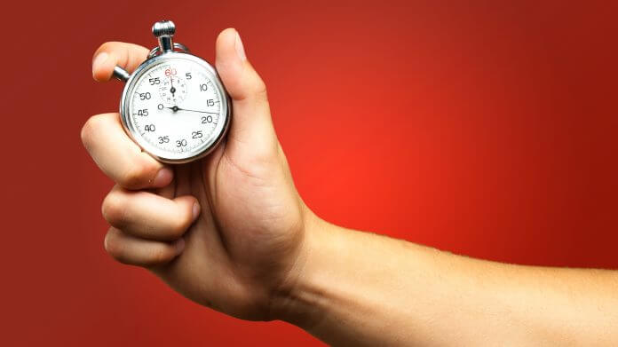 Close Up Of Hand Holding Stopwatch pace